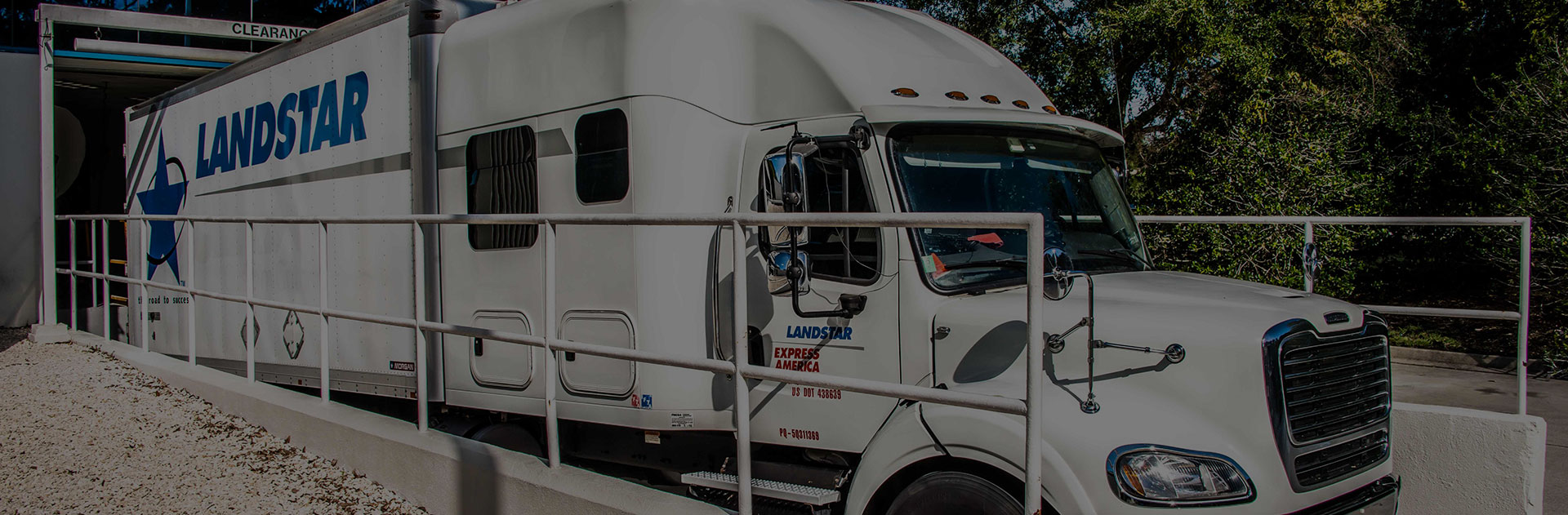 Image of a truck outside of a loading dock.